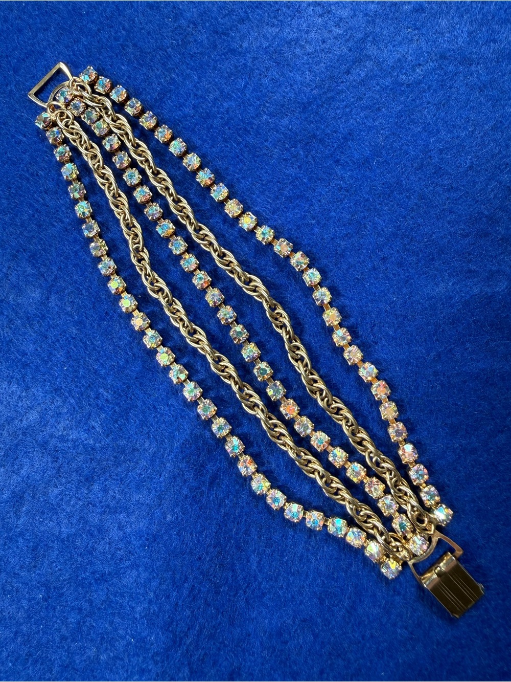 Vintage Multi-strand Aurora Borealis rhinestone and gold tone bracelet.